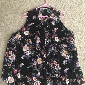 Black, sleeveless shirt with a floral print